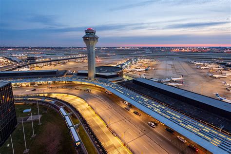 Storm clouds forming over O’Hare airport as travelers wait near gates