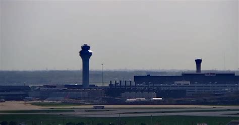 storm clouds over control tower at Chicago O’Hare Airport