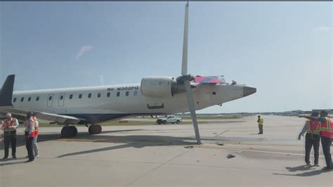 stranded passengers at gate after aircraft ground damage delays flight