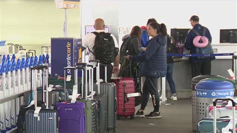 Stranded passengers at Houston Bush Intercontinental Airport during nationwide flight disruptions