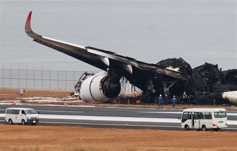 stranded passengers at Noi Bai International Airport terminal after aircraft collision incident