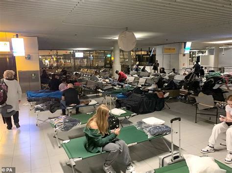 stranded passengers at schiphol terminal during klm cancellation crisis january 2026