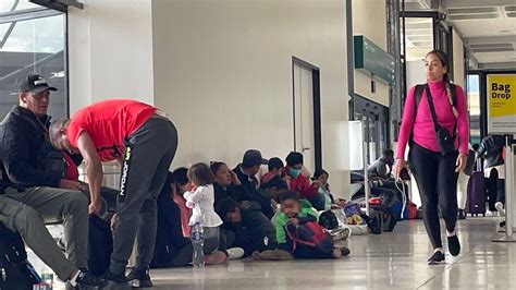 stranded travelers at San Diego Airport during peak season disruptions