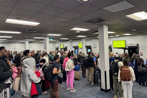 stranded United Airlines passengers waiting overnight at Washington Dulles airport