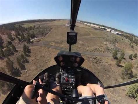 student pilot practicing autorotation maneuver in training helicopter