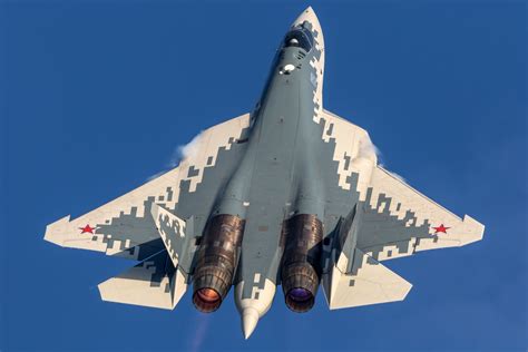 Su-57E fifth-generation stealth fighter performing high-G turn over Algerian desert airspace