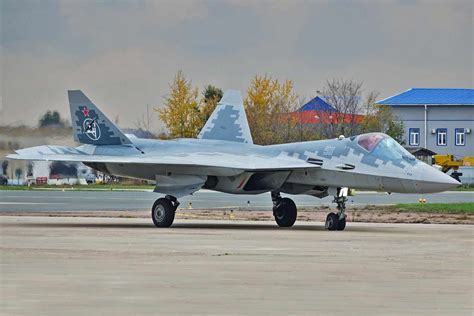 Su-57M showcased during UAC unveiling ceremony with military and aerospace officials present