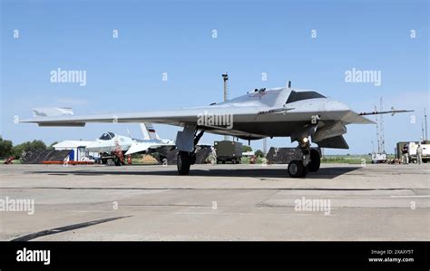 Sukhoi S-70 Okhotnik-B heavy stealth combat drone on runway