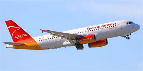 sunrise airways aircraft at toussaint louverture airport apron