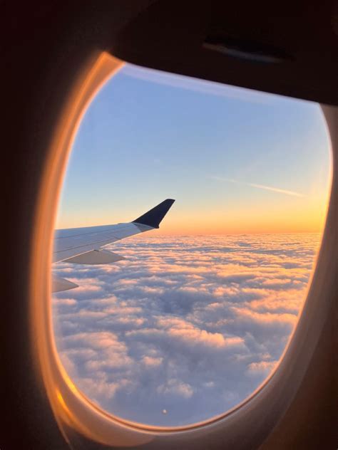 sunrise view from airplane window flying to fiji