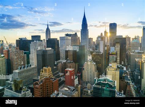 sunset aerial of NYC skyline with Empire State Building and surrounding architecture