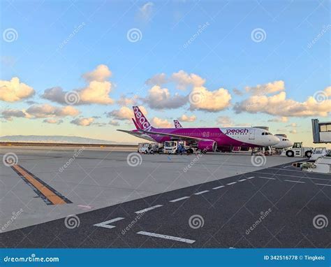 sunset at Kansai International Airport with aircraft parked on apron