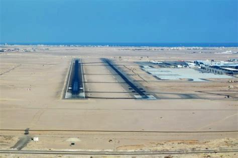 sunset view of Hurghada International Airport runway and surrounding desert landscape