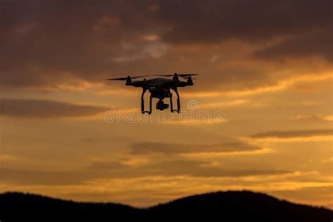 Sunset view with a drone silhouette flying, symbolizing enjoyment of drone hobby