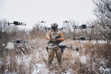 swarm of tactical ISR drones flying autonomously in contested environment
