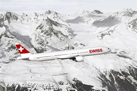 SWISS aircraft flying over the Swiss Alps scenery