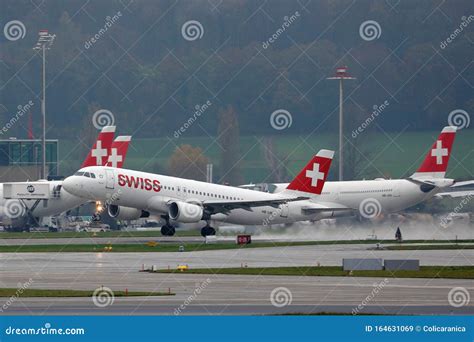 SWISS aircraft taking off Zurich skyline premium airline hub
