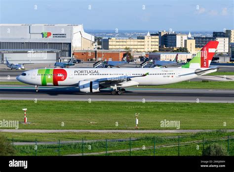 TAP Air Portugal Airbus aircraft landing in Lisbon during sunset