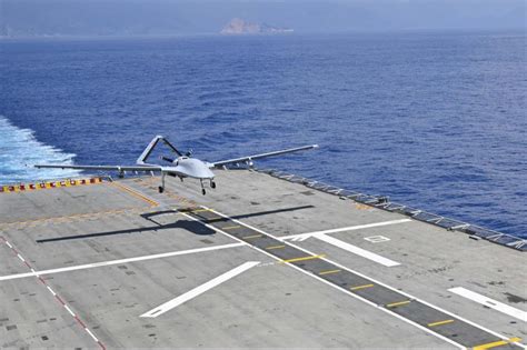 tb3 drone with weapons payload on carrier deck