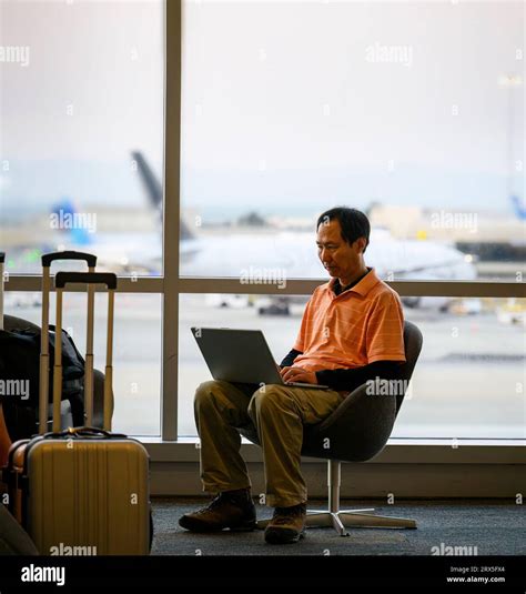 tech-savvy traveler using VPN at airport lounge on laptop