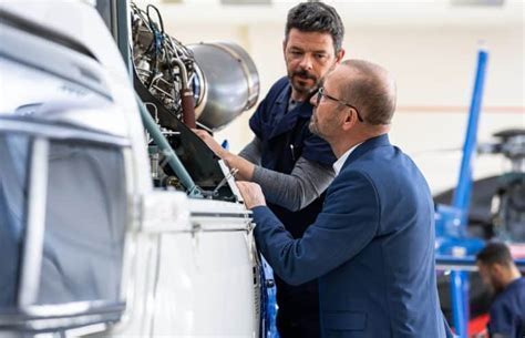 technician calibrating aircraft hydraulic pump during MRO inspection