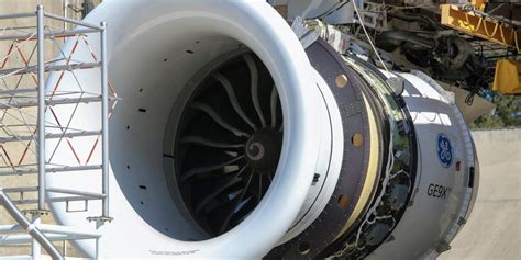 technician monitoring dust-ingestion test chamber for ge9x engine