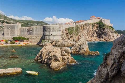 The historic city walls of Dubrovnik overlooking the turquoise Adriatic Sea