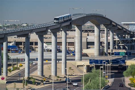 The PHX Sky Train® automated people mover gliding above airport roads