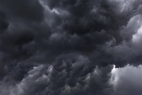 thick storm clouds over JFK Airport as aircraft await clearance
