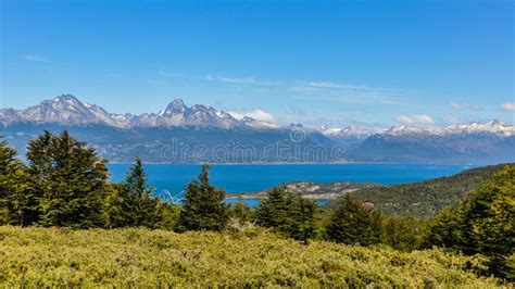 Tierra del Fuego panoramic view with Ushuaia harbor and distant snowy mountains