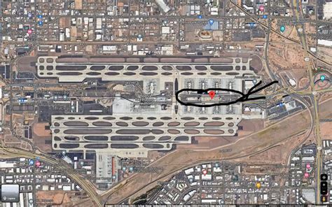 top level of PHX Terminal 4 parking garage with aircraft taxiing below