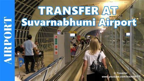 tourist using mobile apps at Suvarnabhumi Airport transfer area