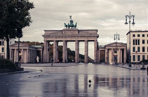 tourists cycling past Berlin’s Brandenburg Gate under 15-minute city initiative