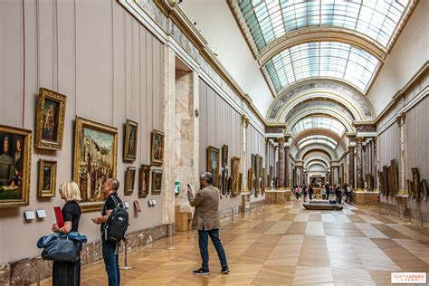 tourists outside closed louvre museum gates june 2025