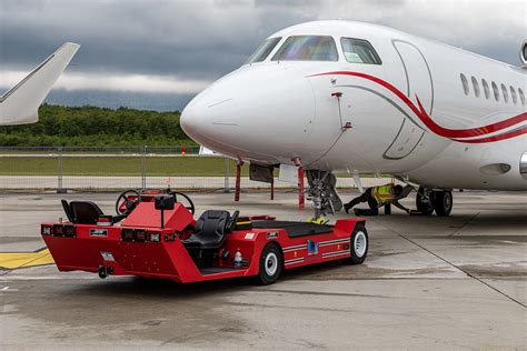 Towbarless tug transporting a Lufthansa Airbus A340-300 at Frankfurt Airport