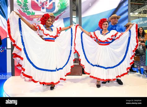 traditional dominican dancers welcoming aeromexico passengers at punta cana airport
