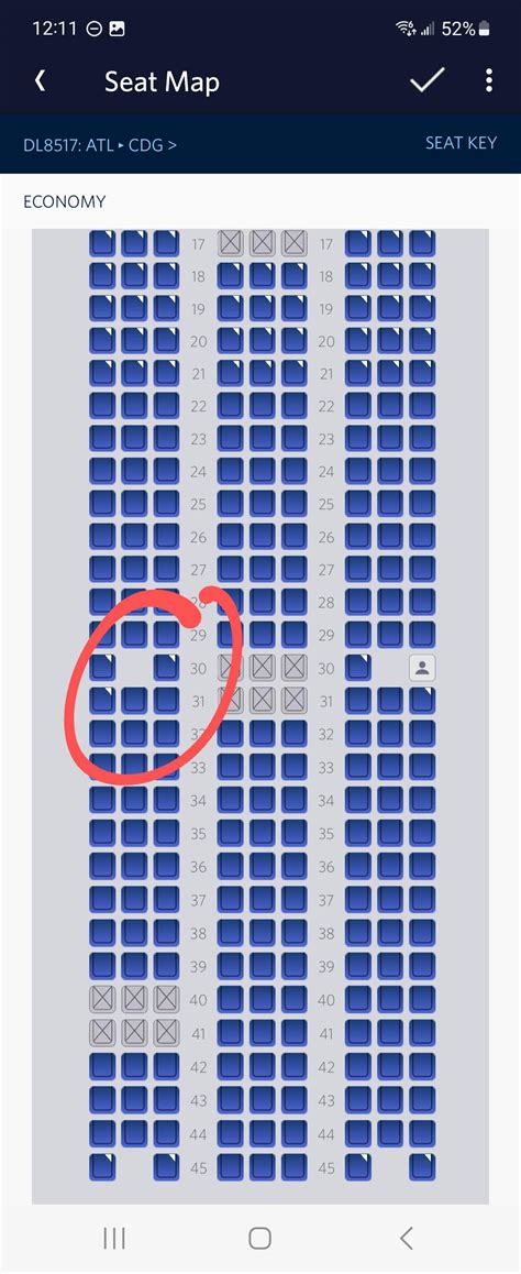 traveler checking Delta airline seat map on smartphone app