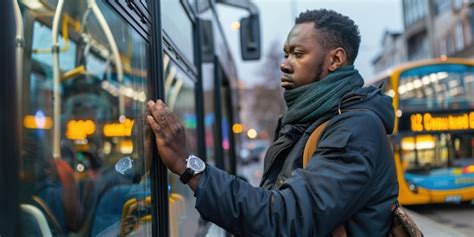 Traveler checking watch anxiously at a bus station