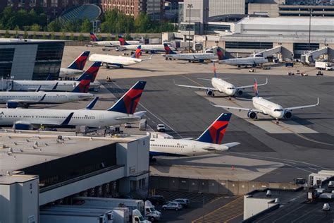 travelers waiting at Boston Logan International during mass flight delays