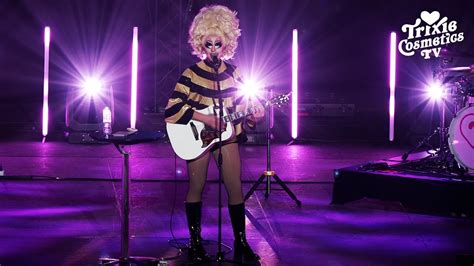 Trixie Mattel DJ set surrounded by vibrant queer crowd