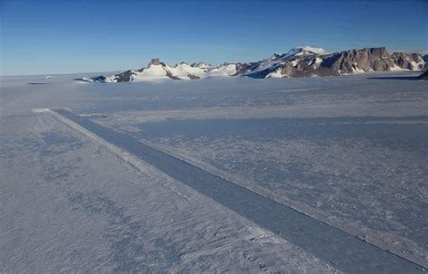 Troll Airfield blue ice runway, surrounded by polar research structures