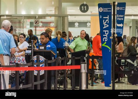 TSA checkpoint with long lines and active travelers in major U.S. airport