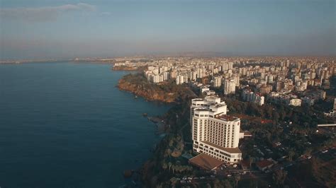 twilight aerial view of Antalya harbor with historic buildings and boats