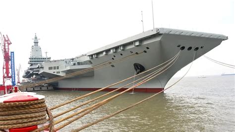 type 003 fujian undergoing sea trials with deck crew in visible safety gear