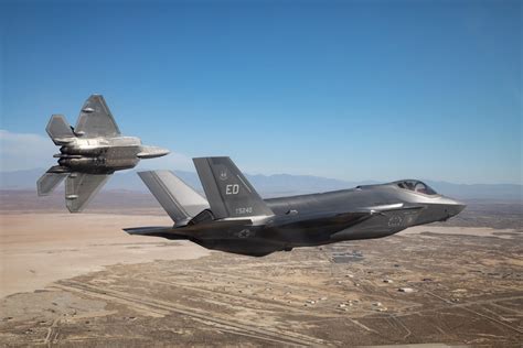 U.S. Air Force and Navy F-35s flying in formation during joint exercise in Pacific region