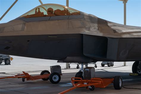 U.S. Air Force maintenance crew servicing F-22 stealth coating