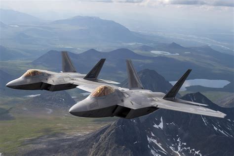 U.S. F-22 Raptor flying formation over the Pacific