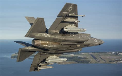 U.S. Navy aircraft conducting joint operations with F/A-18s and F-35s in a coordinated strike mission