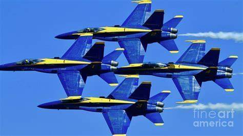 U.S. Navy Blue Angels soaring in diamond formation over downtown Houston during Wings Over Houston