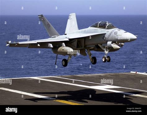 U.S. Navy F/A-18F Super Hornet launching from aircraft carrier in Western Pacific region